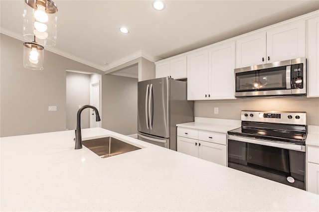 16280 Minorca Dr, Punta Gorda, FL 33955 - kitchen featuring appliances with stainless steel finishes, a sink, recessed lighting, crown molding, and light countertops