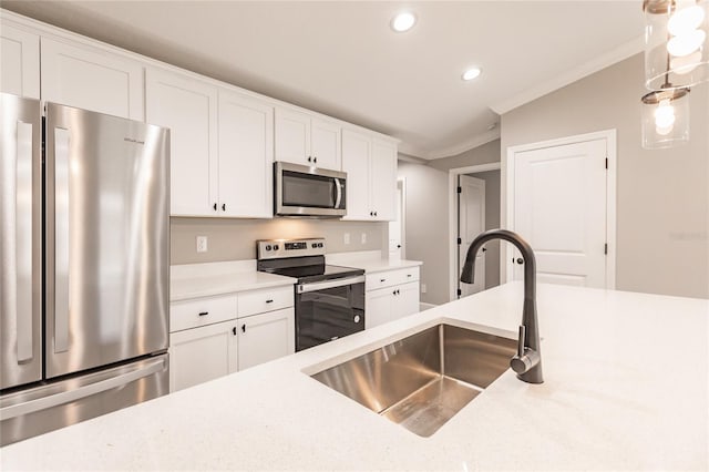 16280 Minorca Dr, Punta Gorda, FL 33955 - kitchen with appliances with stainless steel finishes, a sink, recessed lighting, crown molding, and light countertops