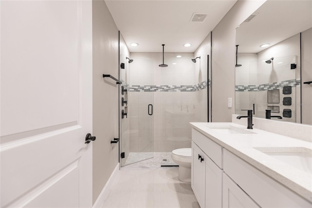 16280 Minorca Dr, Punta Gorda, FL 33955 - bathroom featuring a shower stall, toilet, double vanity, and recessed lighting