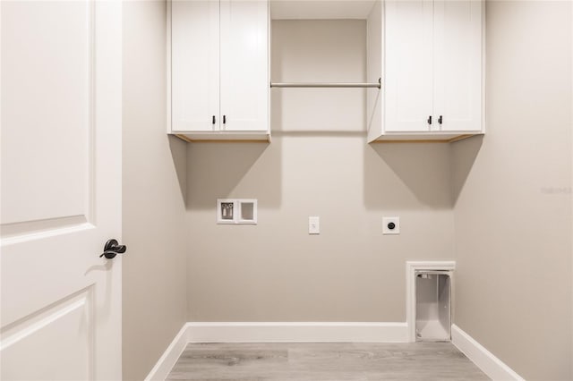 16280 Minorca Dr, Punta Gorda, FL 33955 - laundry room with electric dryer hookup, washer hookup, cabinet space, baseboards, and light wood-style floors