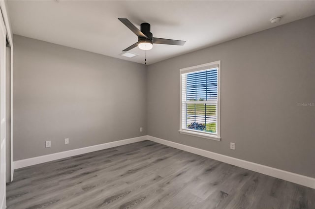 16280 Minorca Dr, Punta Gorda, FL 33955 - unfurnished room with wood finished floors, baseboards, ceiling fan, and a smoke detector