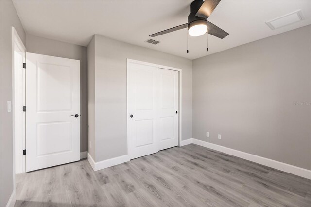 16280 Minorca Dr, Punta Gorda, FL 33955 - unfurnished bedroom with light wood-style flooring, baseboards, a closet, and a ceiling fan