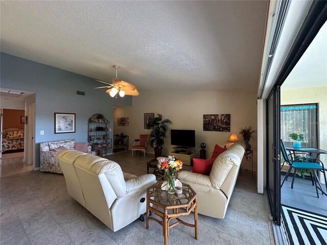 4120 SE 19th Pl Unit 202, Cape Coral, FL 33904 - living area with lofted ceiling, ceiling fan, and a textured ceiling