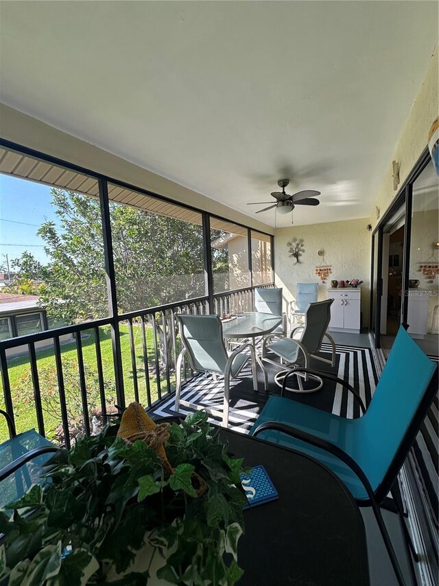 4120 SE 19th Pl Unit 202, Cape Coral, FL 33904 - sunroom featuring ceiling fan, healthy amount of natural light, and outdoor dining space