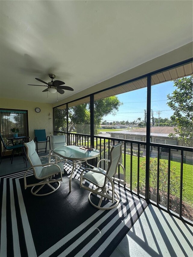 4120 SE 19th Pl Unit 202, Cape Coral, FL 33904 - sunroom featuring a ceiling fan and plenty of natural light