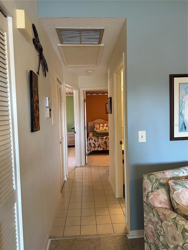 4120 SE 19th Pl Unit 202, Cape Coral, FL 33904 - hallway with light tile patterned floors and baseboards