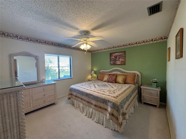 4120 SE 19th Pl Unit 202, Cape Coral, FL 33904 - bedroom featuring carpet, a textured ceiling, a ceiling fan, and baseboards
