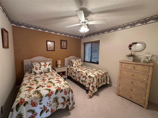 4120 SE 19th Pl Unit 202, Cape Coral, FL 33904 - bedroom featuring a textured ceiling, carpet, and ceiling fan