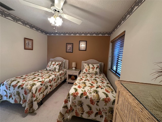 4120 SE 19th Pl Unit 202, Cape Coral, FL 33904 - carpeted bedroom featuring a textured ceiling and a ceiling fan