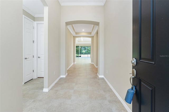 11666 Parrotfish St, Venice, FL 34292 - foyer entrance featuring arched walkways, ornamental molding, baseboards, and light tile patterned flooring
