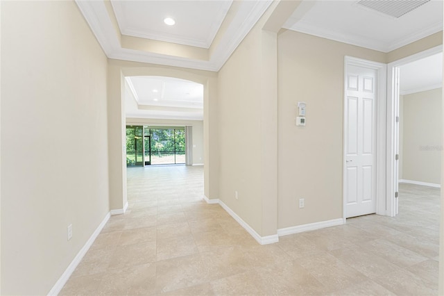 11666 Parrotfish St, Venice, FL 34292 - corridor with arched walkways, a tray ceiling, crown molding, baseboards, and recessed lighting