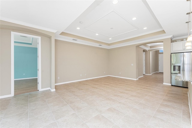 11666 Parrotfish St, Venice, FL 34292 - spare room with light tile patterned floors, arched walkways, a tray ceiling, ornamental molding, and baseboards