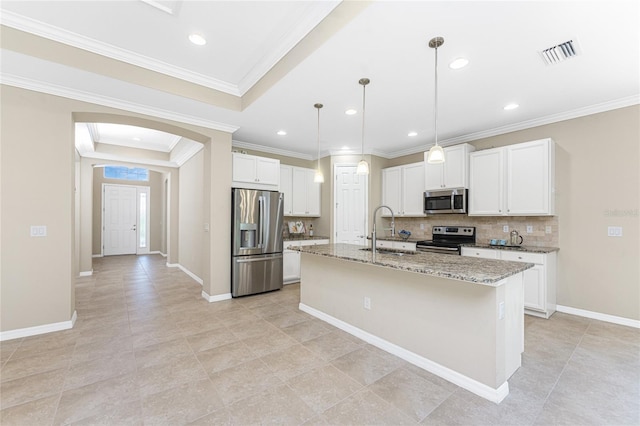 11666 Parrotfish St, Venice, FL 34292 - kitchen with stainless steel appliances, a sink, arched walkways, backsplash, and light stone countertops