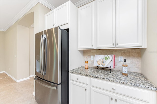 11666 Parrotfish St, Venice, FL 34292 - kitchen featuring stainless steel fridge with ice dispenser, decorative backsplash, light stone counters, white cabinetry, and crown molding