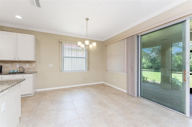 11666 Parrotfish St, Venice, FL 34292 - unfurnished dining area with crown molding, a chandelier, baseboards, and light tile patterned floors