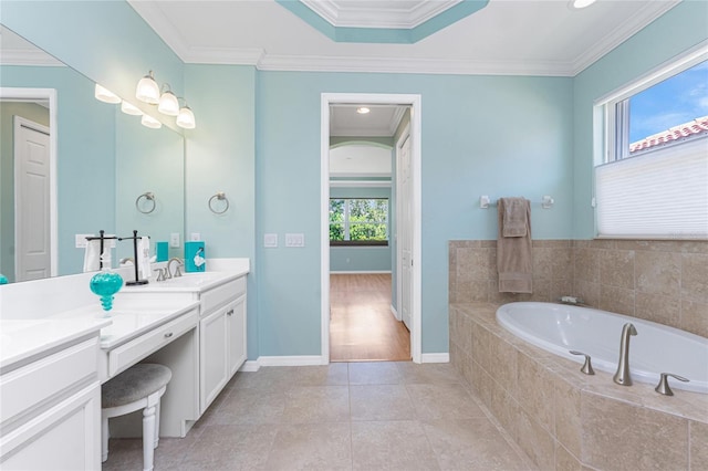 11666 Parrotfish St, Venice, FL 34292 - bathroom featuring vanity, a garden tub, ornamental molding, baseboards, and tile patterned floors