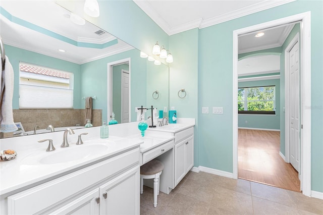 11666 Parrotfish St, Venice, FL 34292 - full bathroom with double vanity, ornamental molding, tile patterned floors, and baseboards