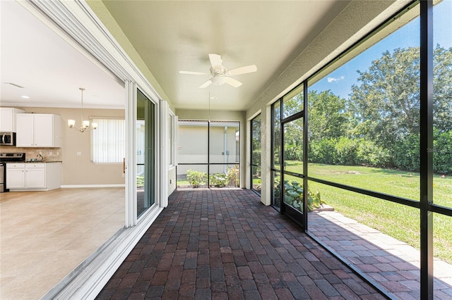 11666 Parrotfish St, Venice, FL 34292 - unfurnished sunroom with ceiling fan, healthy amount of natural light, and a chandelier