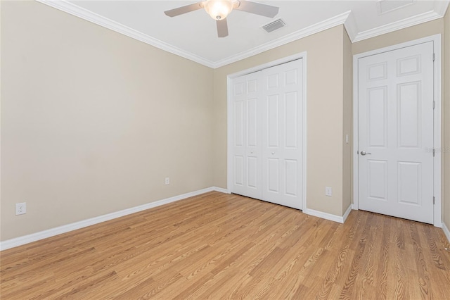 11666 Parrotfish St, Venice, FL 34292 - unfurnished bedroom featuring light wood-style floors, baseboards, ornamental molding, a closet, and a ceiling fan