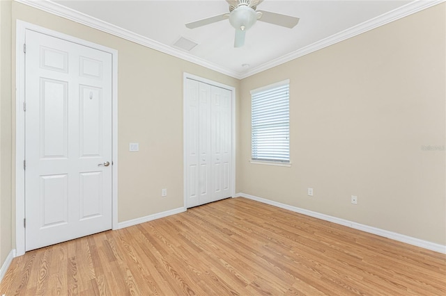 11666 Parrotfish St, Venice, FL 34292 - unfurnished bedroom featuring baseboards, light wood-type flooring, ornamental molding, a ceiling fan, and a closet