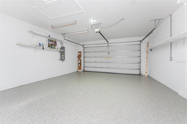 11666 Parrotfish St, Venice, FL 34292 - garage featuring electric panel, concrete block wall, and a garage door opener