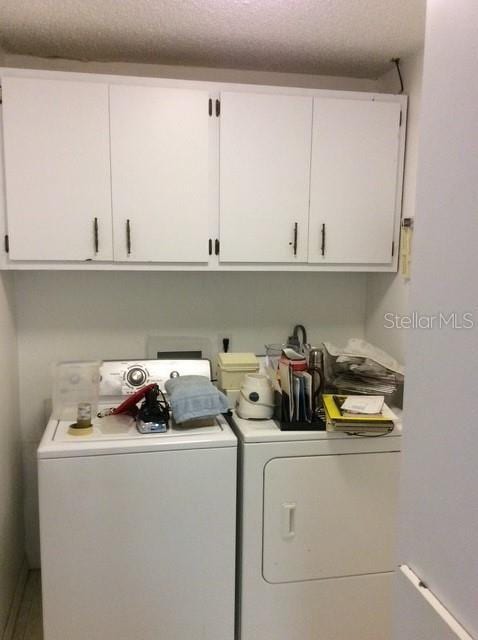 23220 Rountree Ave, Port Charlotte, FL 33980 - laundry area with separate washer and dryer and cabinet space