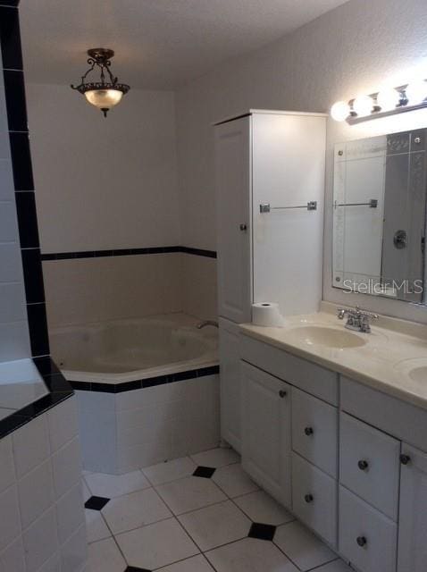 23220 Rountree Ave, Port Charlotte, FL 33980 - bathroom with a bath, double vanity, and tile patterned floors
