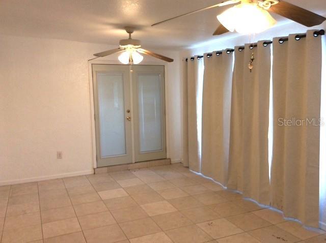 23220 Rountree Ave, Port Charlotte, FL 33980 - empty room with ceiling fan and baseboards