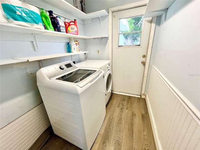481 Reading St NW, Port Charlotte, FL 33952 - laundry room with wood finished floors and independent washer and dryer