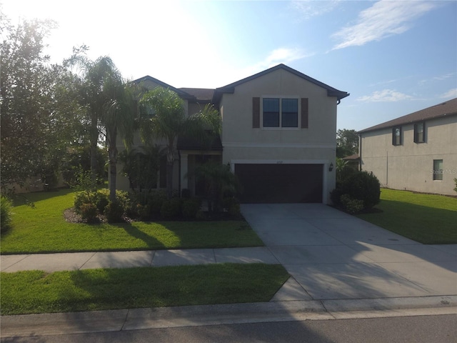 2739 Sherman Oak Dr, North Port, FL 34289 - view of front of property with a garage, a front yard, driveway, and stucco siding