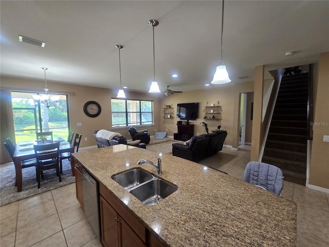 2739 Sherman Oak Dr, North Port, FL 34289 - kitchen featuring a sink, open floor plan, dishwasher, light tile patterned floors, and pendant lighting