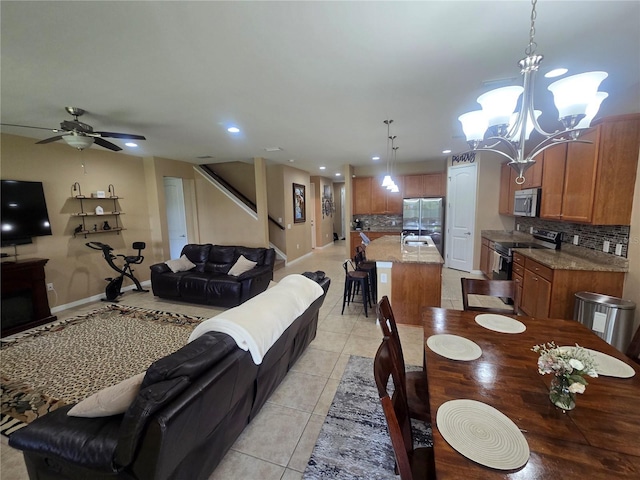 2739 Sherman Oak Dr, North Port, FL 34289 - dining space with a chandelier, light tile patterned floors, recessed lighting, baseboards, and a ceiling fan