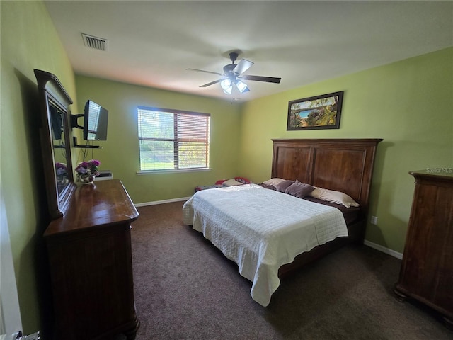 2739 Sherman Oak Dr, North Port, FL 34289 - bedroom featuring dark carpet, baseboards, and a ceiling fan