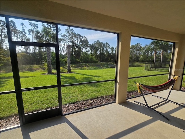 2739 Sherman Oak Dr, North Port, FL 34289 - unfurnished sunroom with view of wooded area