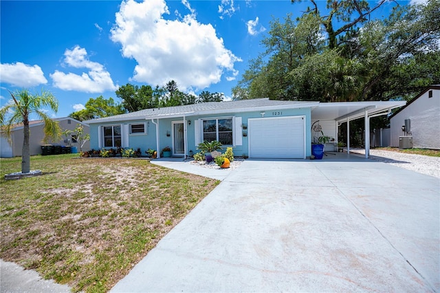 7231 Elyton Dr, North Port, FL 34287 - ranch-style home with concrete driveway, an attached garage, a front lawn, and cooling unit