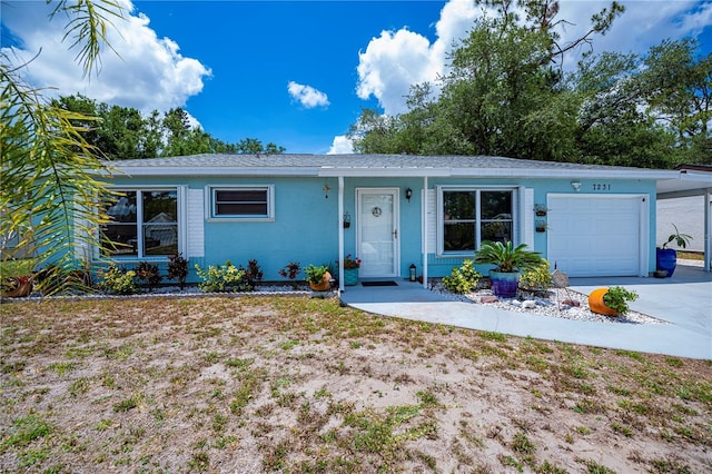 7231 Elyton Dr, North Port, FL 34287 - ranch-style home featuring a garage and concrete driveway
