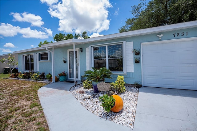 7231 Elyton Dr, North Port, FL 34287 - ranch-style home featuring a garage, stucco siding, and concrete driveway