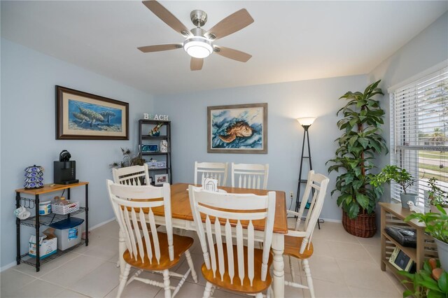 7231 Elyton Dr, North Port, FL 34287 - dining space with light tile patterned floors, a ceiling fan, and baseboards