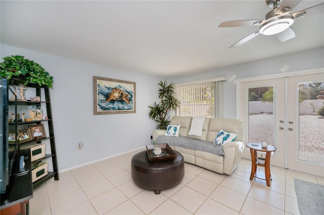 7231 Elyton Dr, North Port, FL 34287 - living area featuring french doors, a ceiling fan, light tile patterned floors, and baseboards