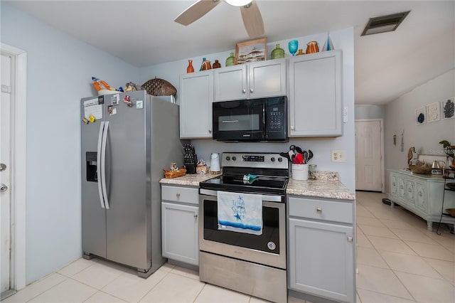 7231 Elyton Dr, North Port, FL 34287 - kitchen with stainless steel appliances, light tile patterned flooring, and a ceiling fan