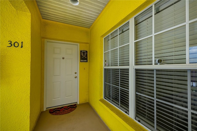 2060 Willow Hammock Cir Unit 301, Punta Gorda, FL 33983 - view of exterior entry featuring stucco siding