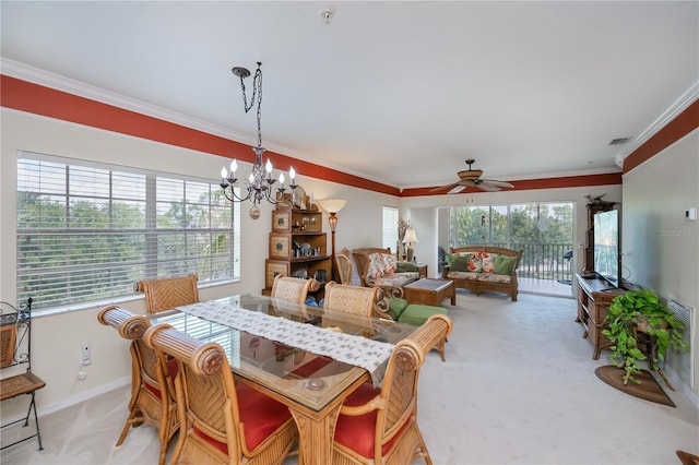 2060 Willow Hammock Cir Unit 301, Punta Gorda, FL 33983 - dining space featuring light colored carpet, crown molding, a ceiling fan, a chandelier, and baseboards