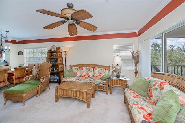 2060 Willow Hammock Cir Unit 301, Punta Gorda, FL 33983 - carpeted living area featuring ornamental molding, ceiling fan, and a chandelier