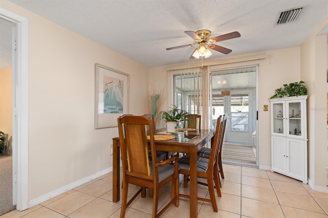 315 Holly Rd, Venice, FL 34293 - dining area featuring a ceiling fan, light tile patterned flooring, and baseboards
