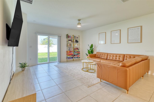 111 Rain Lily Ave, Spring Hill, FL 34609 - living room with ceiling fan and light tile patterned floors