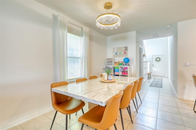 111 Rain Lily Ave, Spring Hill, FL 34609 - dining room featuring a chandelier and light tile patterned floors