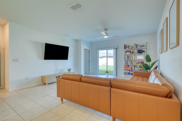 111 Rain Lily Ave, Spring Hill, FL 34609 - living room featuring a ceiling fan and light tile patterned floors