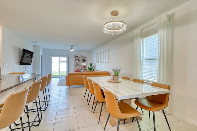 111 Rain Lily Ave, Spring Hill, FL 34609 - dining area featuring a chandelier and light tile patterned floors