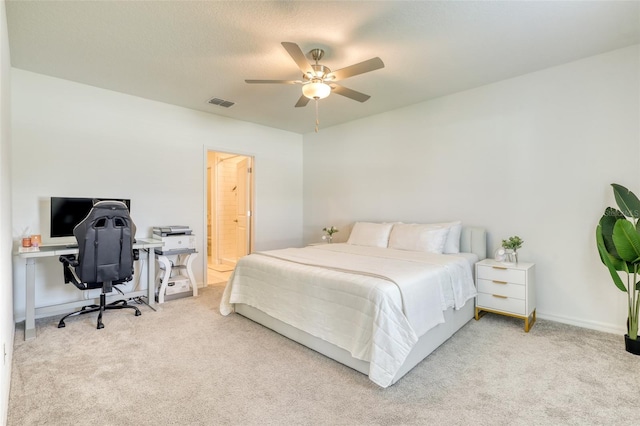 111 Rain Lily Ave, Spring Hill, FL 34609 - carpeted bedroom with an office area, a ceiling fan, and ensuite bathroom