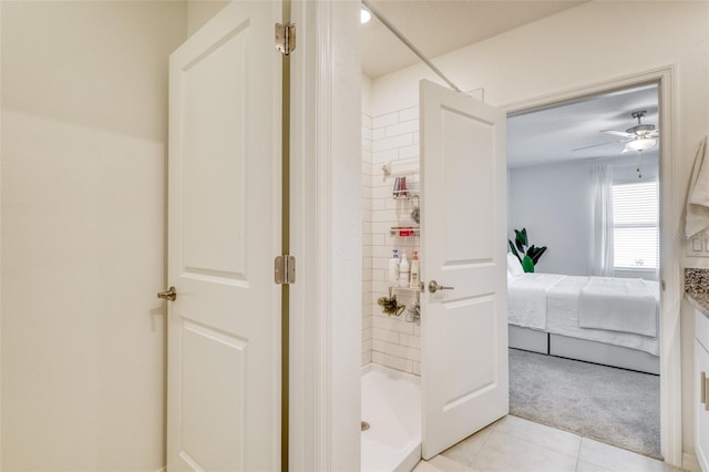 111 Rain Lily Ave, Spring Hill, FL 34609 - bathroom with ensuite bathroom, a stall shower, tile patterned flooring, and ceiling fan